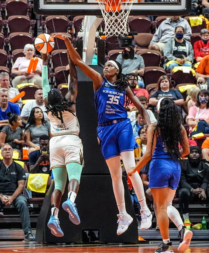 Jonquel Jones blocks a shot from the Liberty's Jazmine Jones